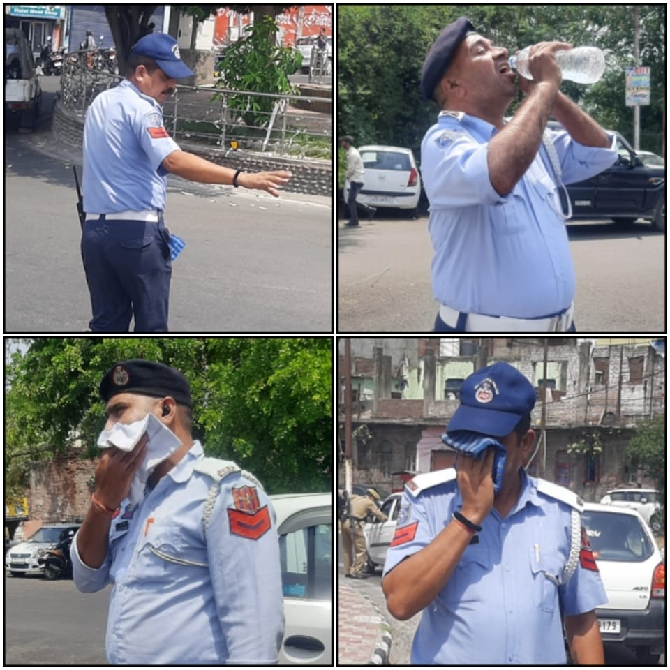'As mercury soars, Traffic Cops sweat out under searing sun and regulates traffic in Jammu City'
